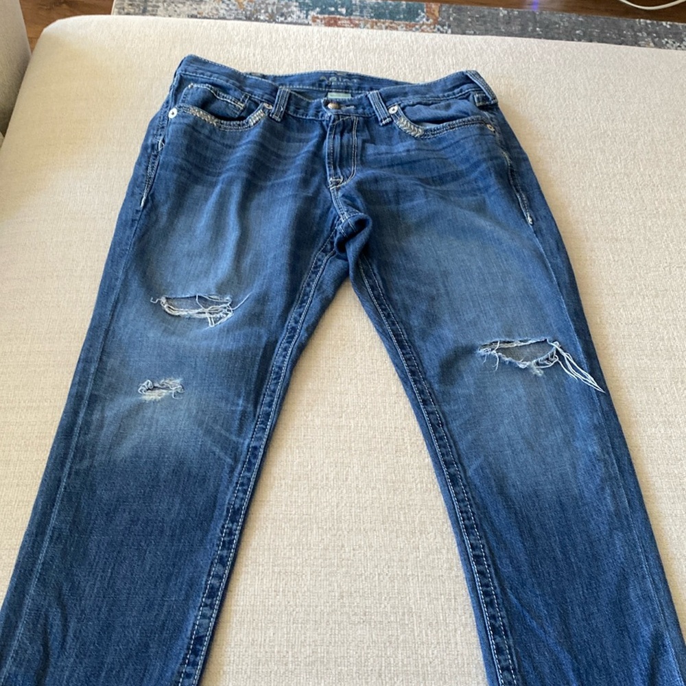 Ariat boyfriend distressed jeans.